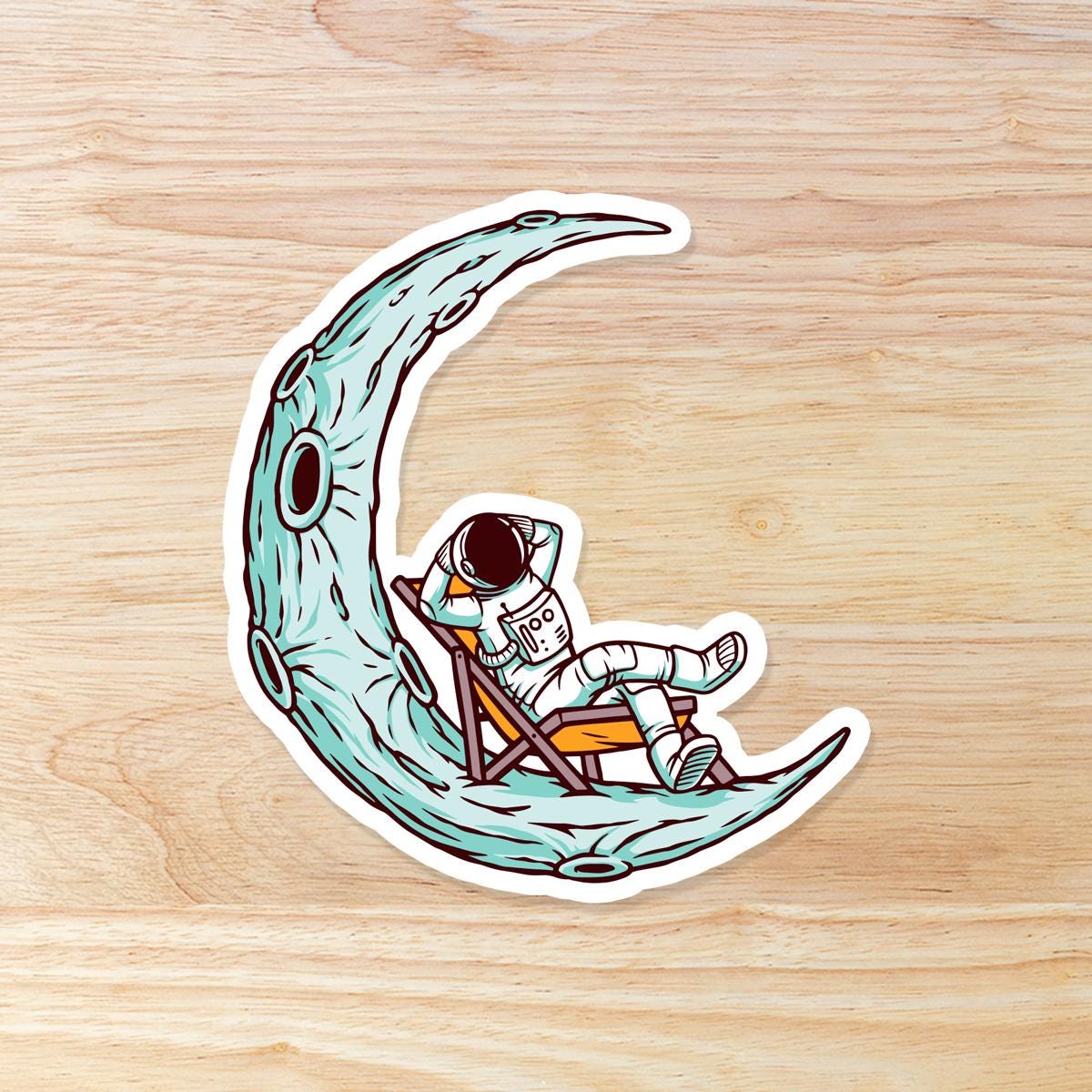 Astronaut Lounging on Moon: Waterproof Vinyl Sticker